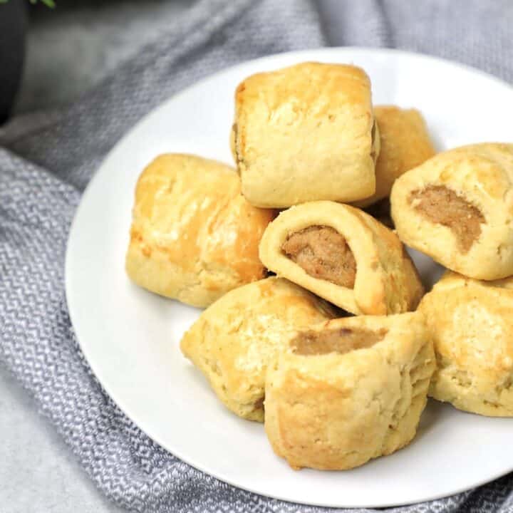 mini chicken sausage rolls on a plate.