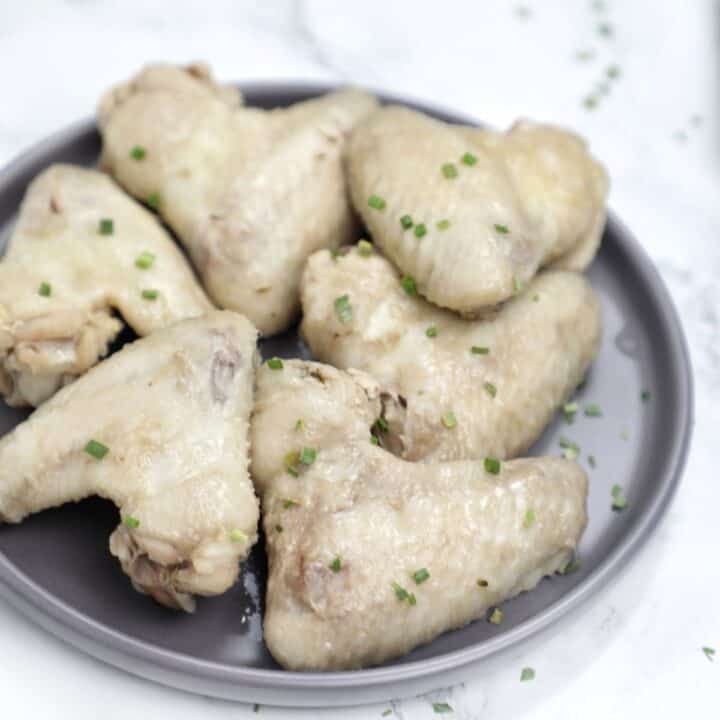 boiled chicken wings on a plate.