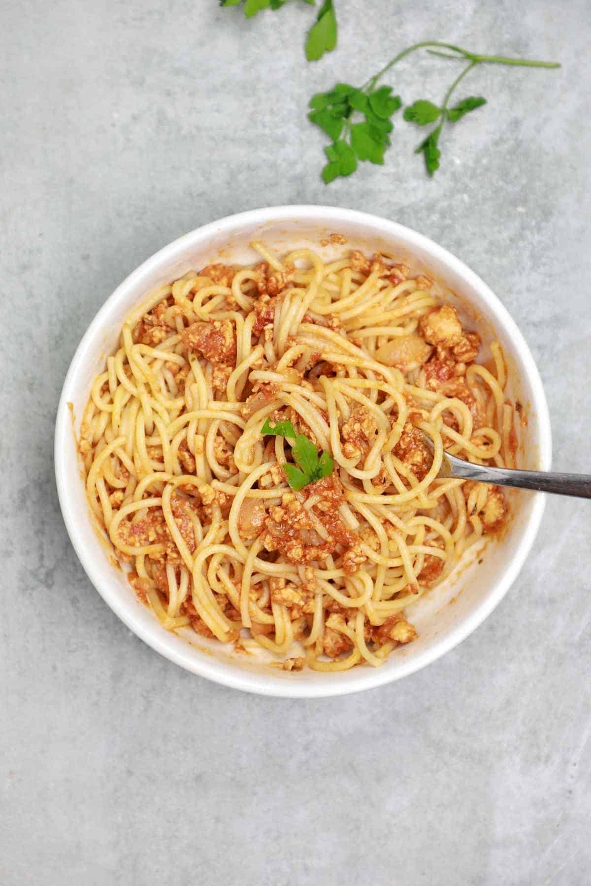 chicken spaghetti bolognese in a plate.