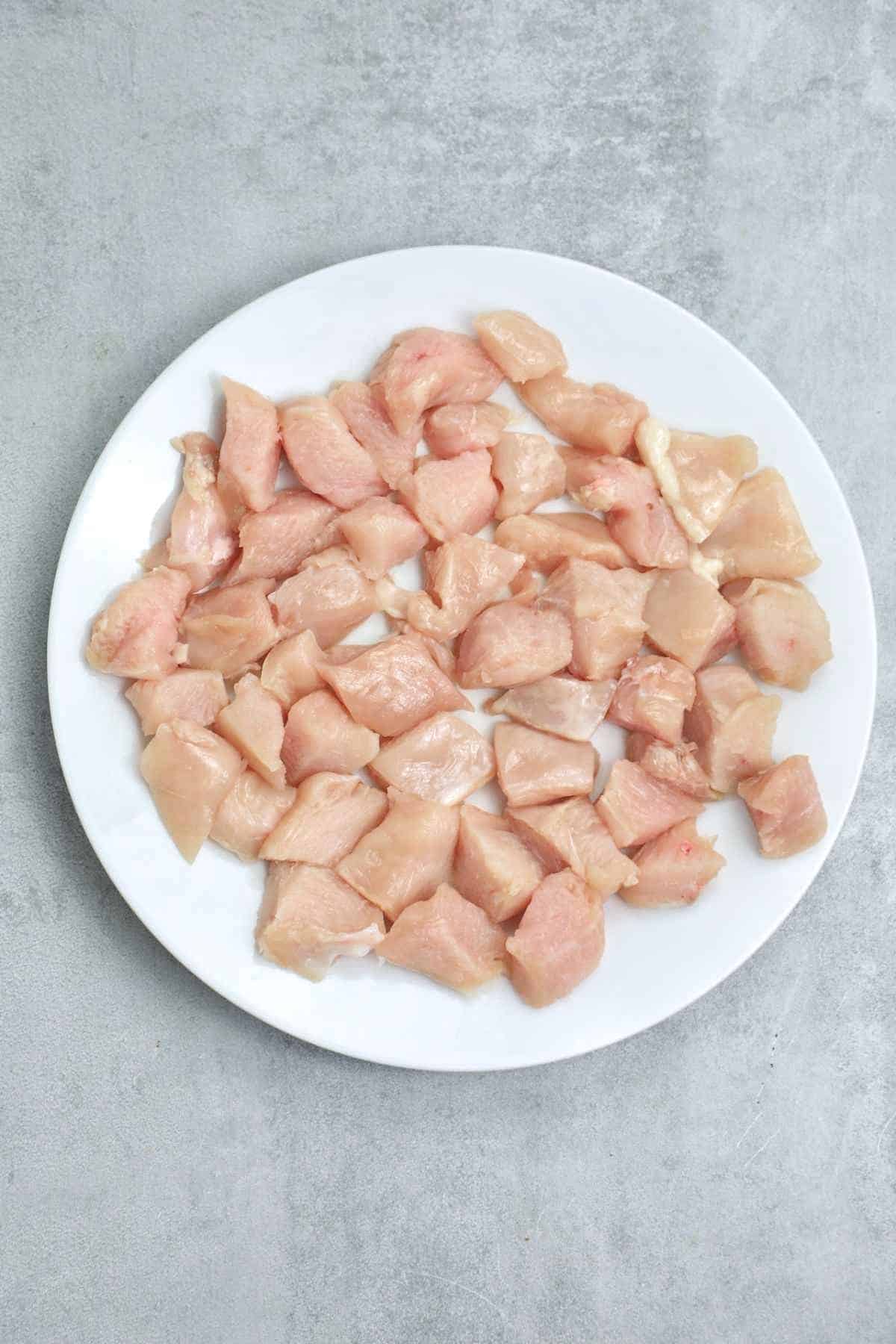 diced frozen chicken on a plate.