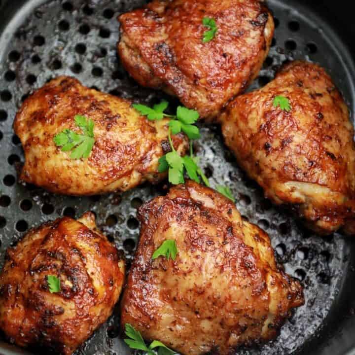 cooked frozen chicken thighs garnished with parsley.