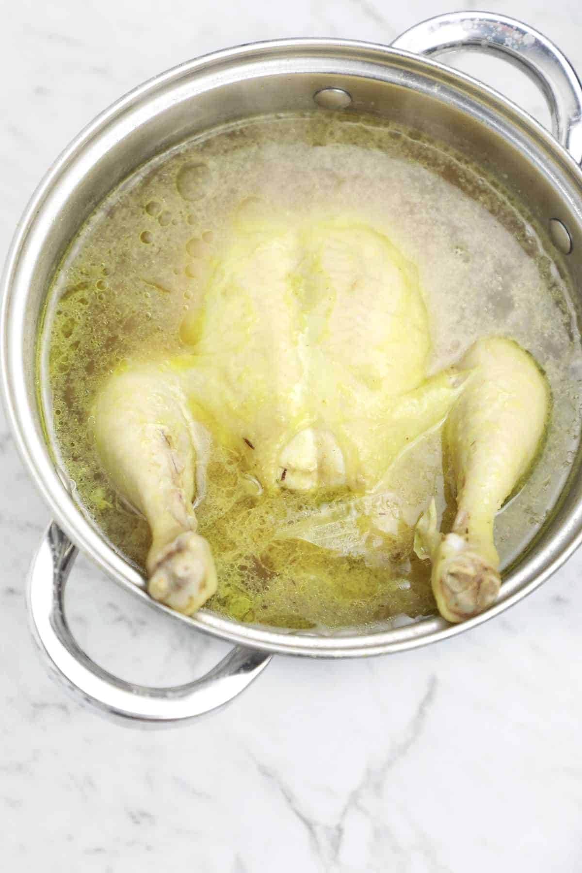 cooked chicken in a pot.