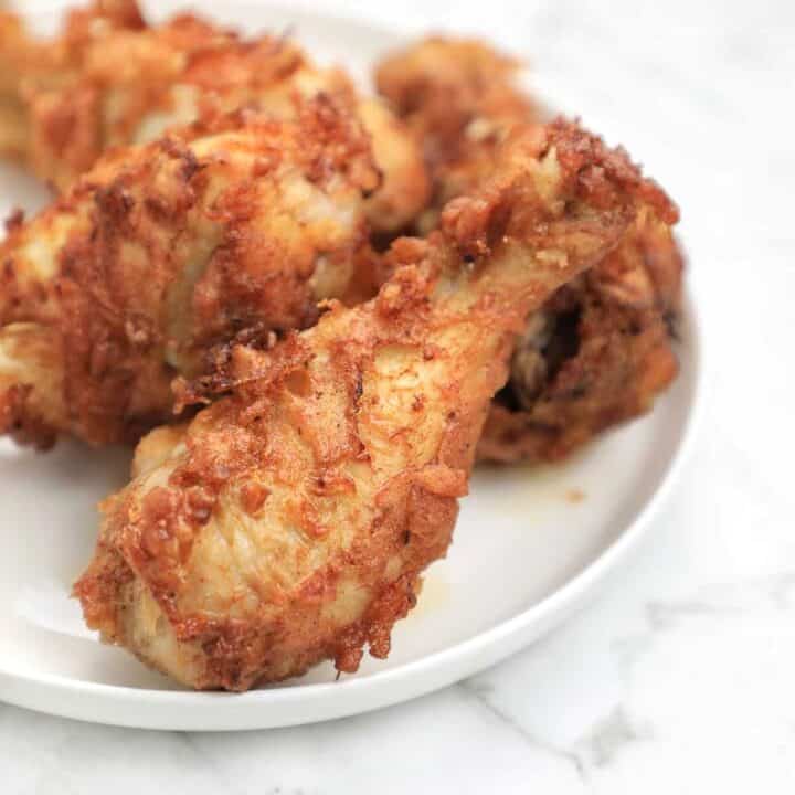 fried chicken legs on a plate.