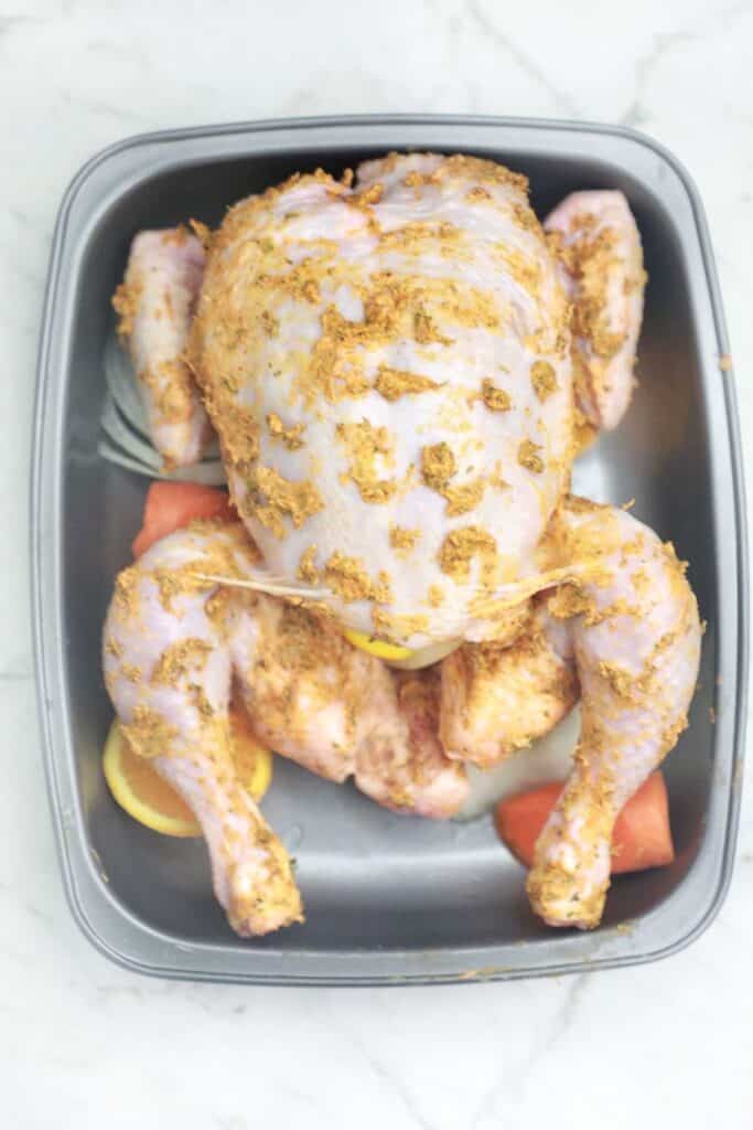marinated chicken in a baking tray.