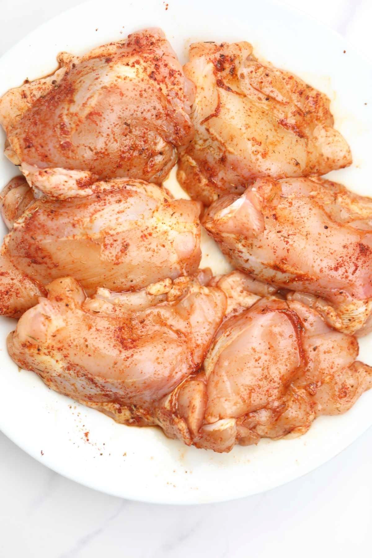 seasoned chicken on a plate.