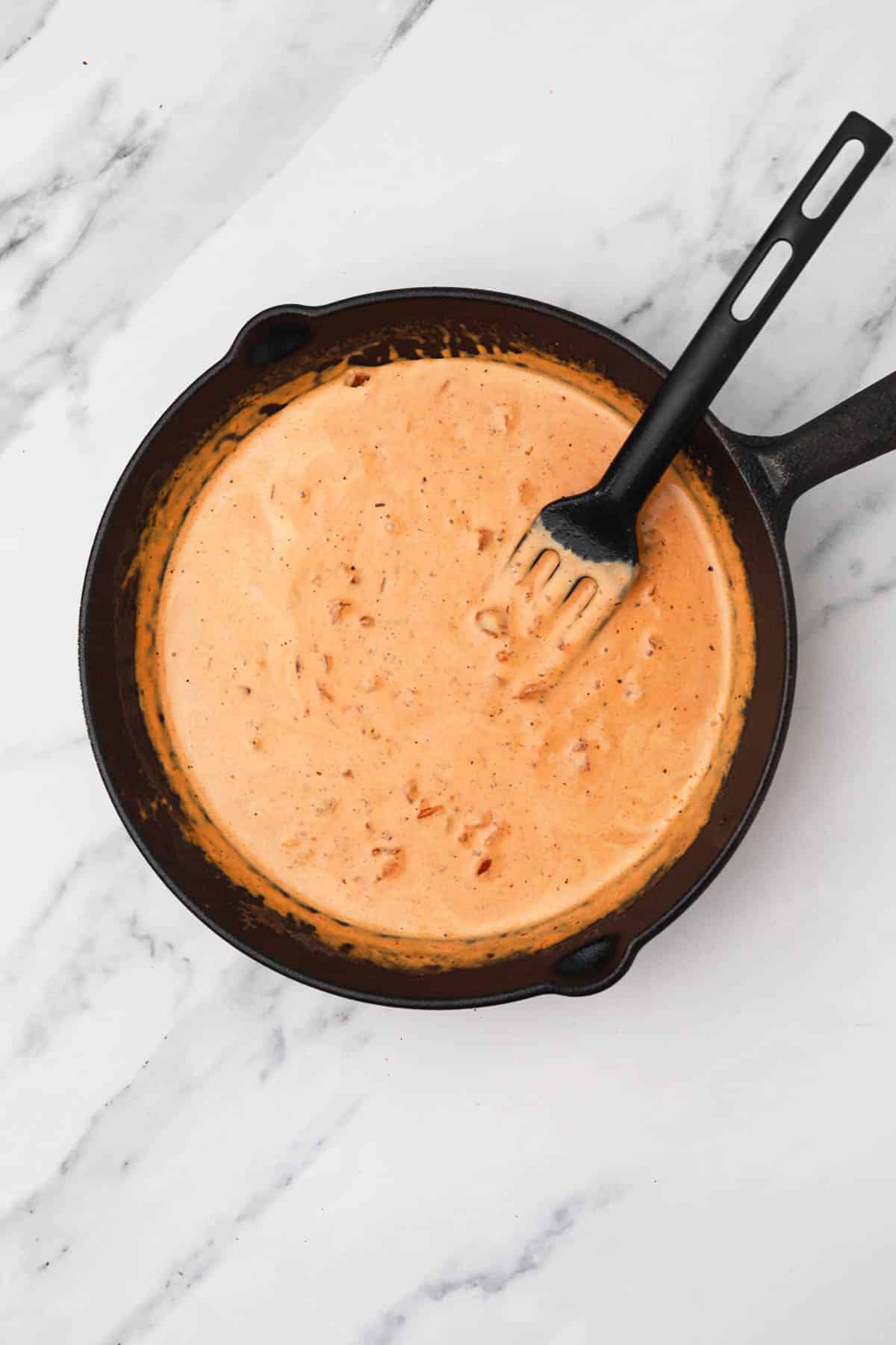 the creamy sauce in the skillet.