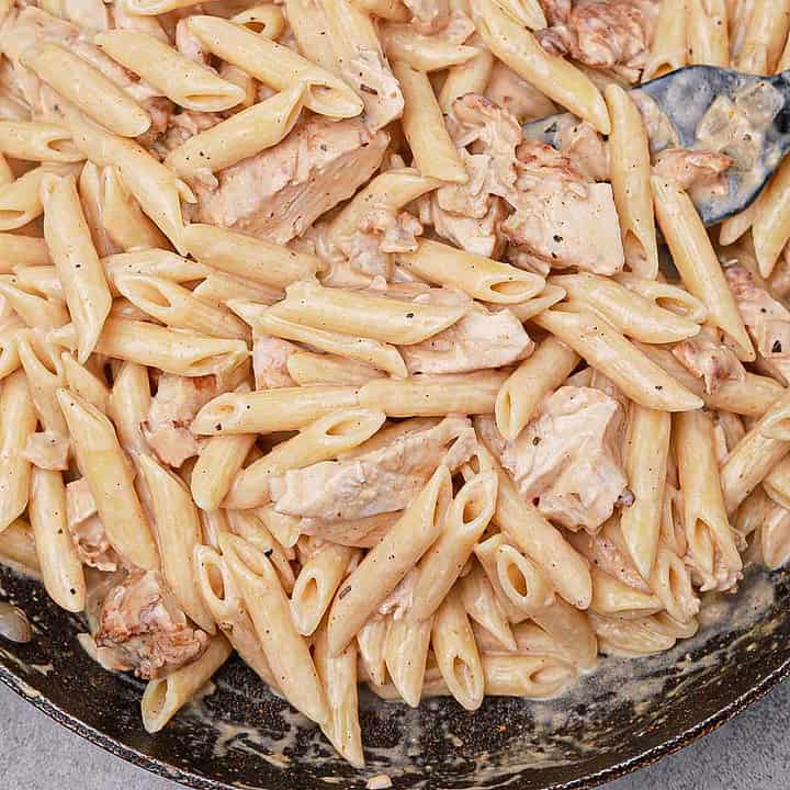 cooked Philadelphia cream cheese chicken pasta in a pan.
