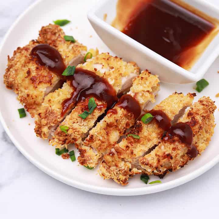 chickent katsu sliced and served on a plate.